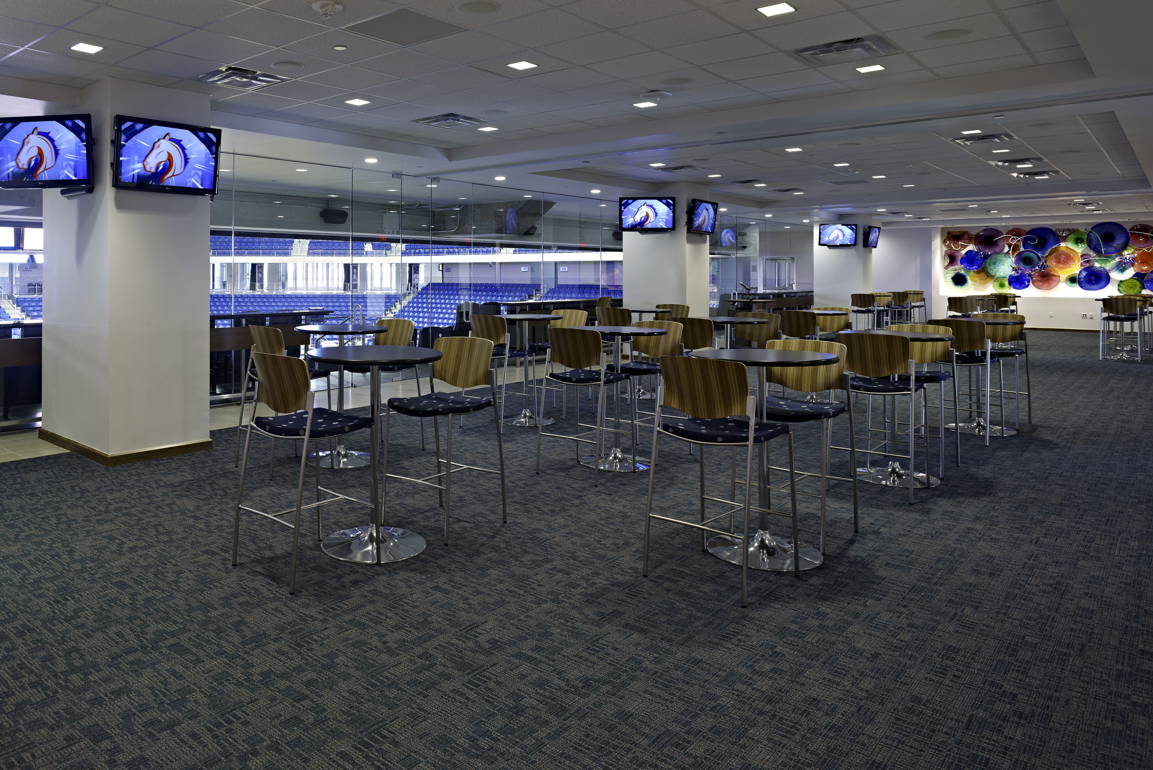 Hospitality suite set up with tables at COllege Park Center. View of the arena from the wiindows